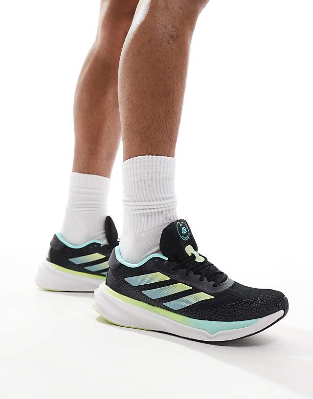asos adidas Running Supernova Stride trainers in black and aqua