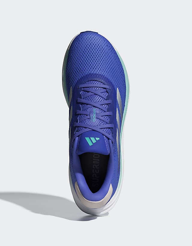 Asos Adidas Running Supernova Stride Trainers In Blue