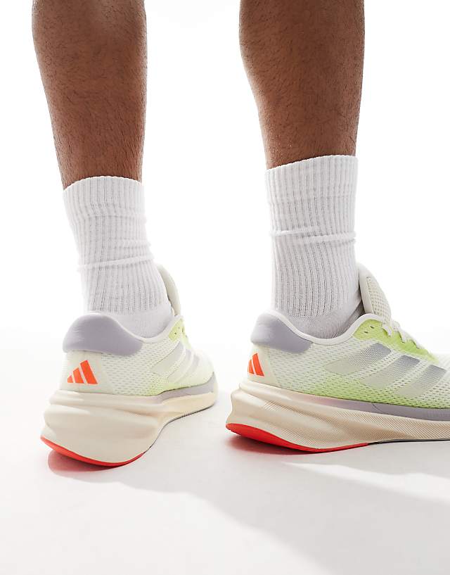 Asos Adidas Running Supernova Stride Trainers In Off White And Lime