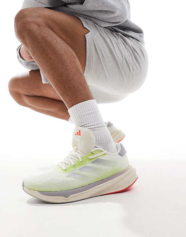 asos adidas Running Supernova Stride trainers in off white and lime
