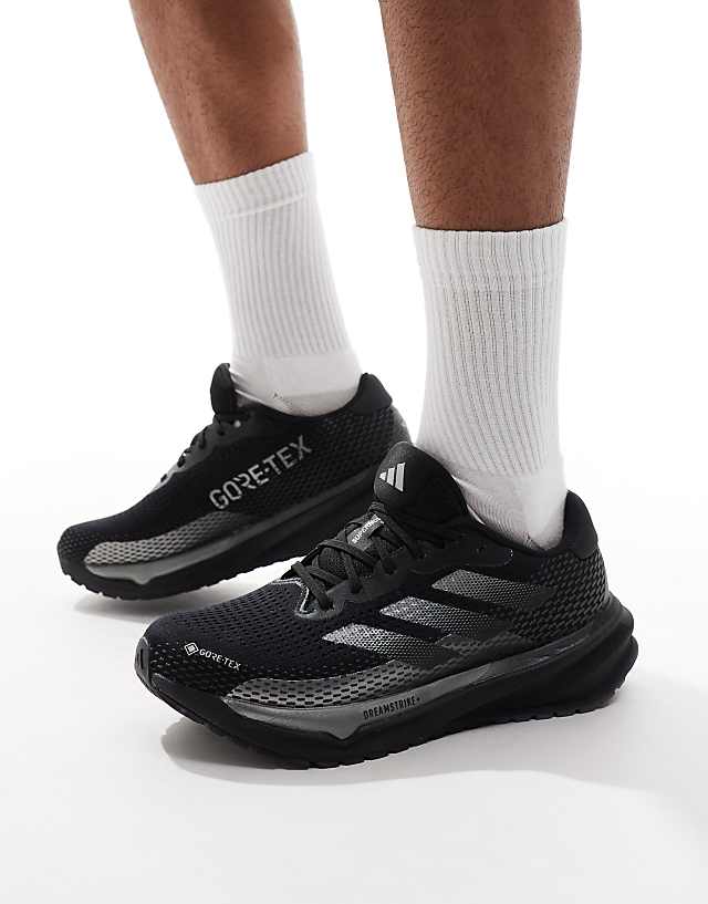 asos adidas Running supernova trainers in black