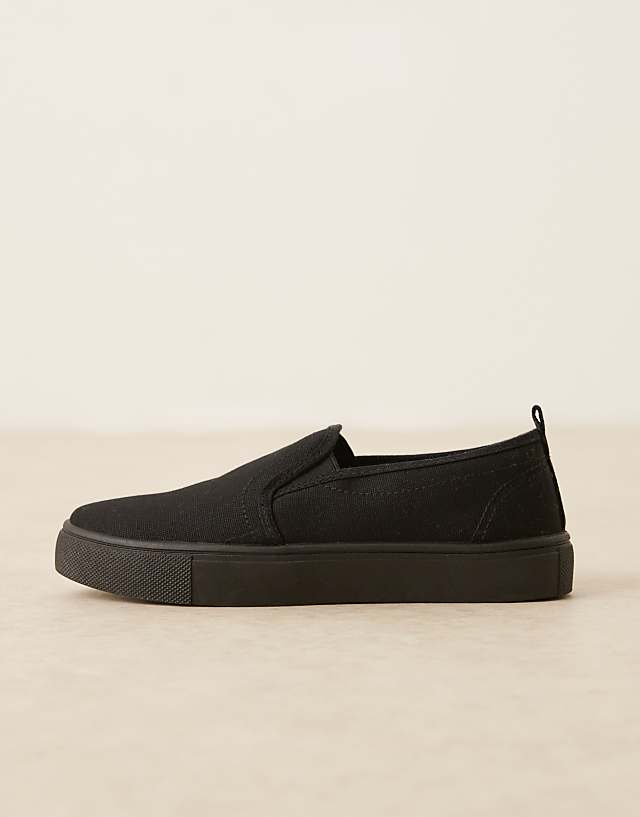 Asos ASOS DESIGN Dotty Slip On Plimsolls In Black