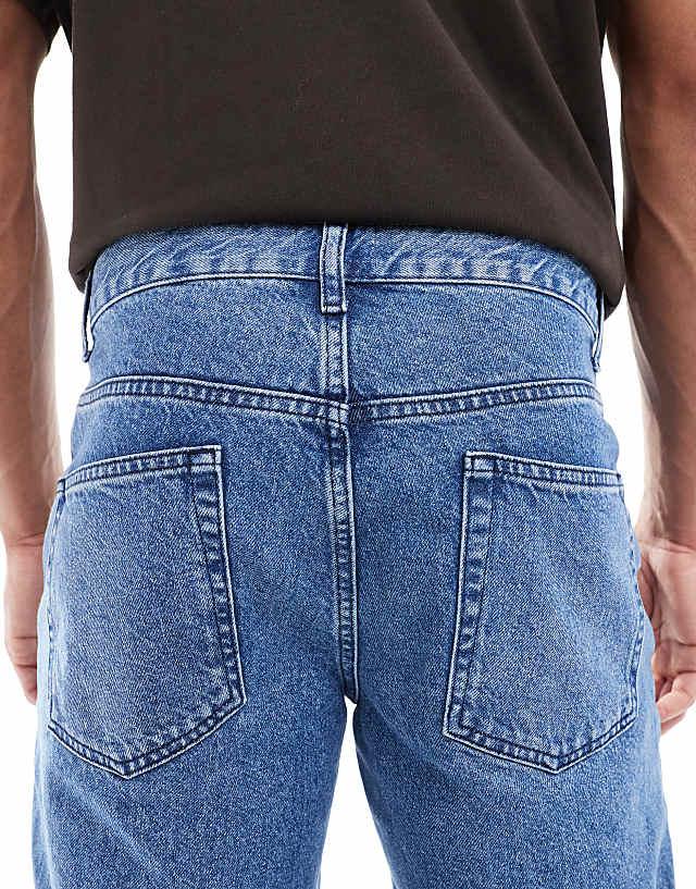 Asos ASOS DESIGN Tapered Jean In Mid Wash Blue