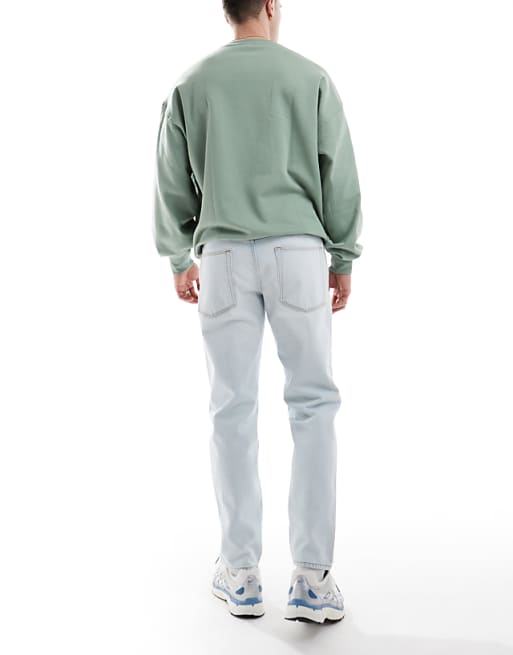 Asos ASOS DESIGN Tapered Jeans In Bleach Wash Blue