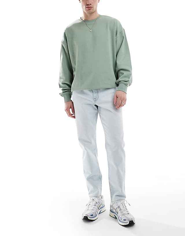 asos ASOS DESIGN tapered jeans in bleach wash blue