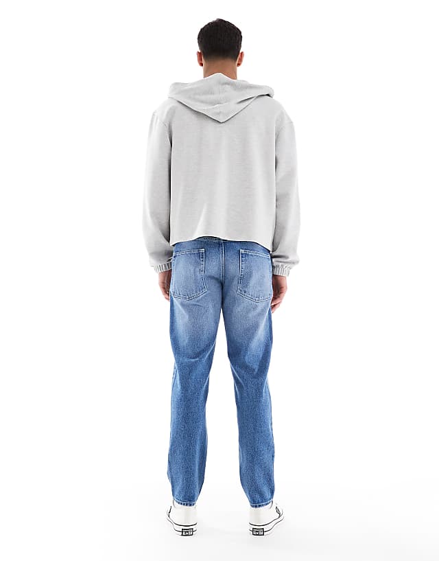 Asos ASOS DESIGN Tapered Jeans In Light Wash Blue