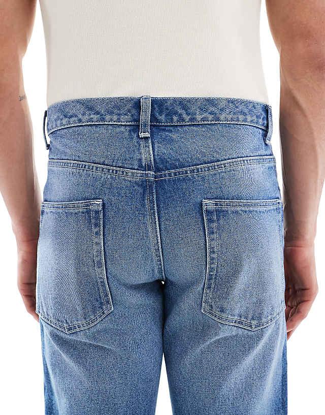 Asos ASOS DESIGN Tapered Jeans In Light Wash Blue