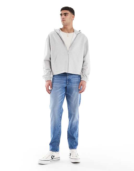 asos ASOS DESIGN tapered jeans in light wash blue