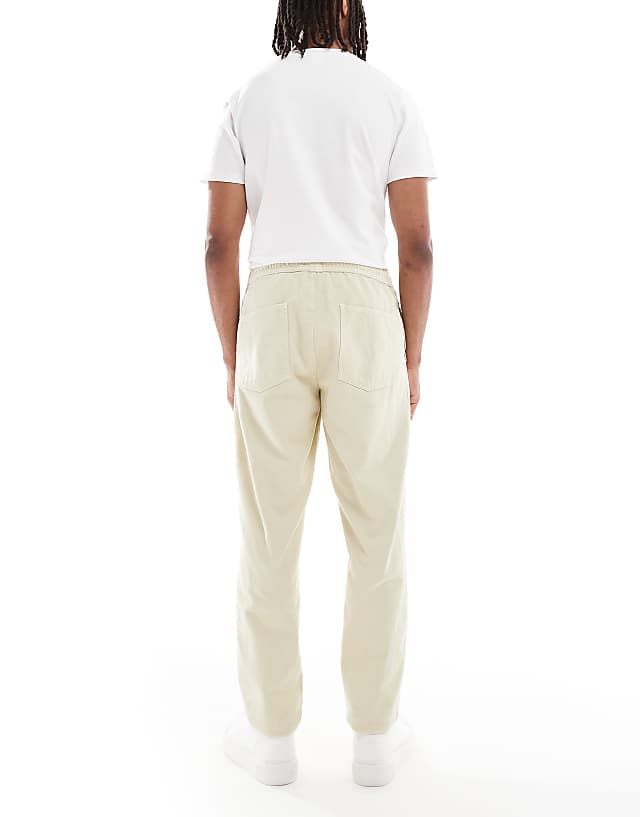 Asos ASOS DESIGN Tapered Pull On Chinos In Beige