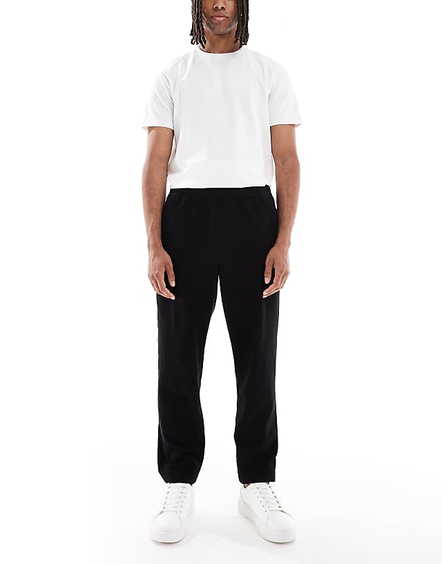 asos ASOS DESIGN tapered pull on chinos in black