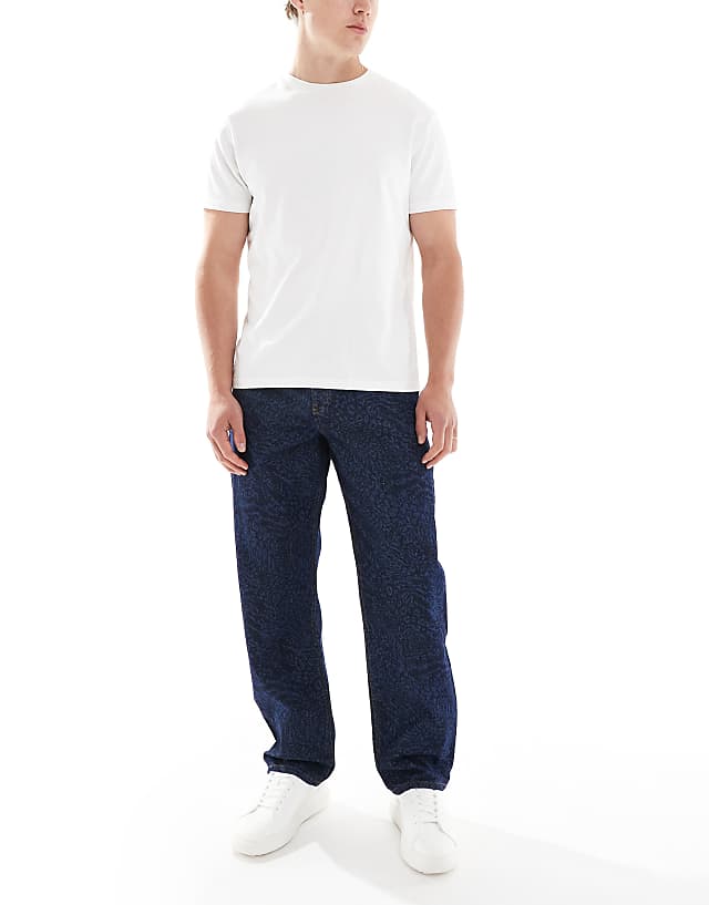 asos ASOS DESIGN baggy jeans with mixed animal laser print in raw wash