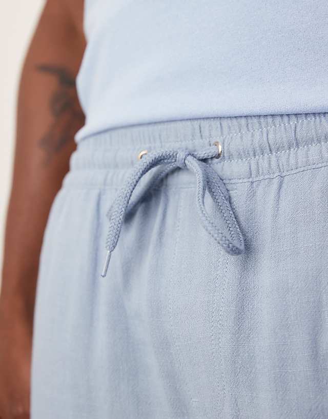 Asos ASOS DESIGN Baggy Pull On Shorts In Blue Linen Rich