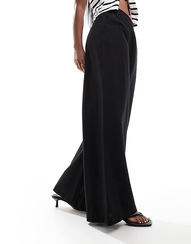 asos ASOS DESIGN bias cut relaxed trouser with linen in black