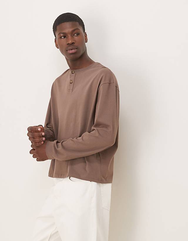 asos ASOS DESIGN boxy oversized long sleeve henley t-shirt in washed black