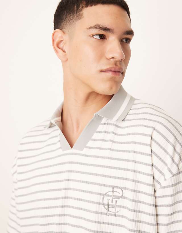 Asos ASOS DESIGN Boxy Oversized Polo With Chest Logo In Blue And White Ribbed Stripe