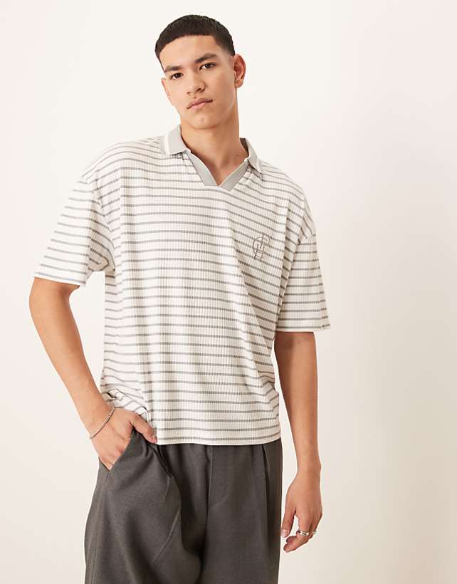 asos ASOS DESIGN boxy oversized polo with chest logo in blue and white ribbed stripe