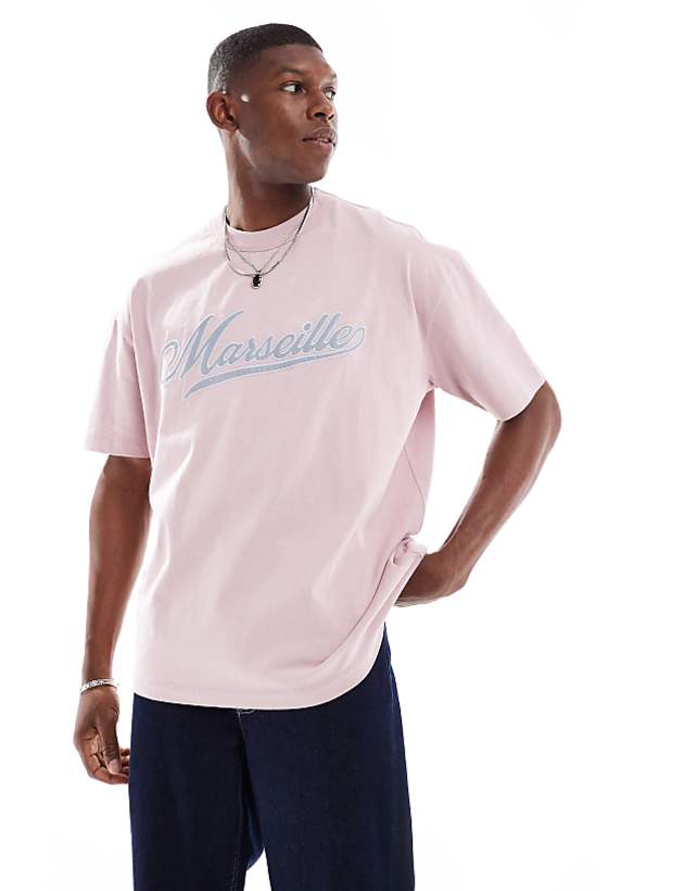 asos ASOS DESIGN boxy oversized t-shirt with city text applique in light pink
