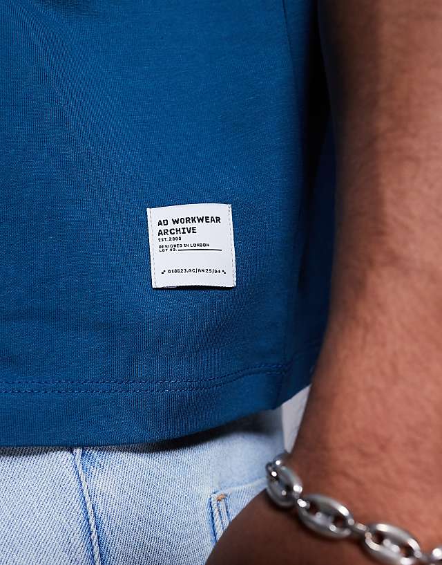 Asos ASOS DESIGN Boxy Oversized T-shirt With Text Graphic In Blue
