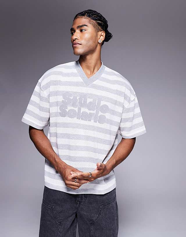 asos ASOS DESIGN boxy oversized t-shirt with v-neck and text graphic in textured stripe