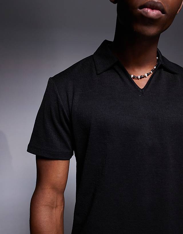 Asos ASOS DESIGN Boxy Polo With Deep Neckline In Black Texture