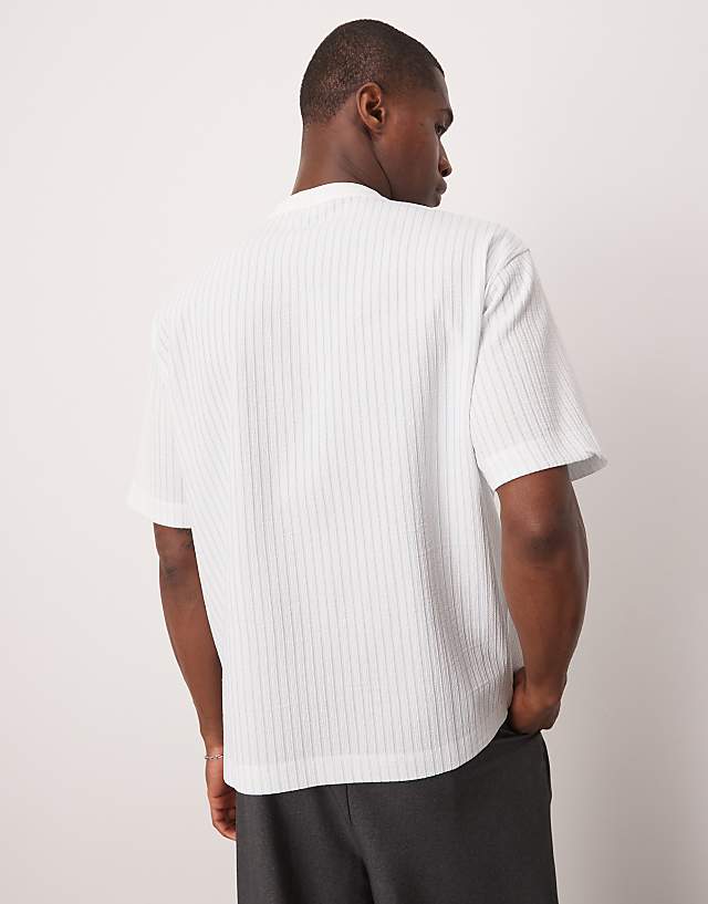 Asos ASOS DESIGN Boxy Relaxed T-shirt With Chest Pocket In Blue And White Textured Stripe