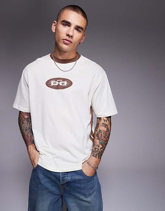 asos ASOS DESIGN boxy relaxed t-shirt with panelling and text graphic in cream pique