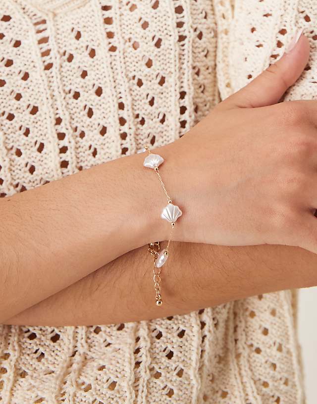 asos ASOS DESIGN bracelet with faux pearl shells in gold tone