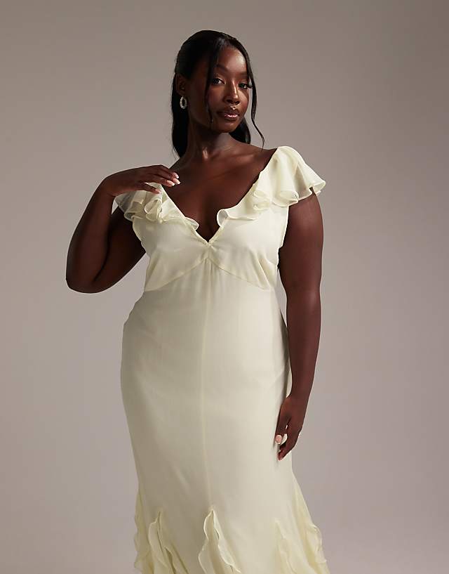 Asos ASOS DESIGN Curve Bridesmaids Flutter Sleeve Bias Maxi Dress With Godet Frill Hem In Soft Yellow