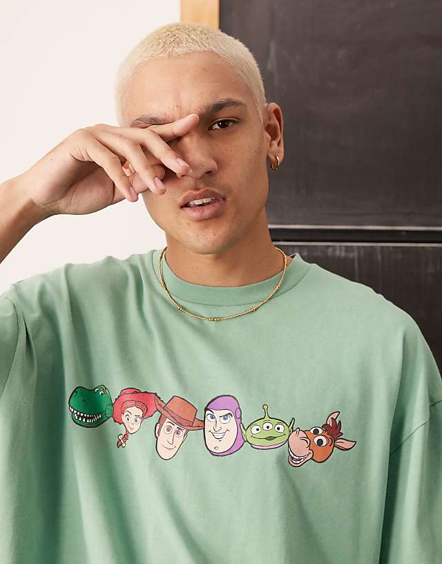 Asos ASOS DESIGN Disney Pixar Oversized T-shirt With Toy Story Prints In Washed Green