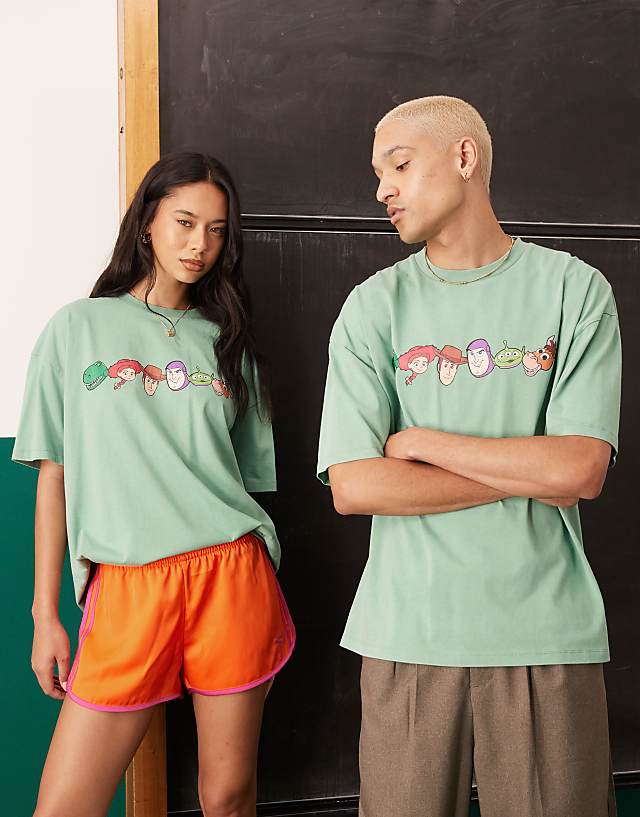 Asos ASOS DESIGN Disney Pixar Oversized T-shirt With Toy Story Prints In Washed Green
