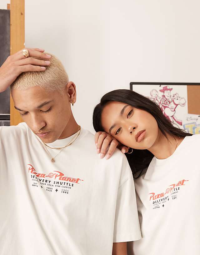 Asos ASOS DESIGN Disney Pixar Unisex Oversized T-shirt With Toy Story Pizza Planet Prints In Washed White