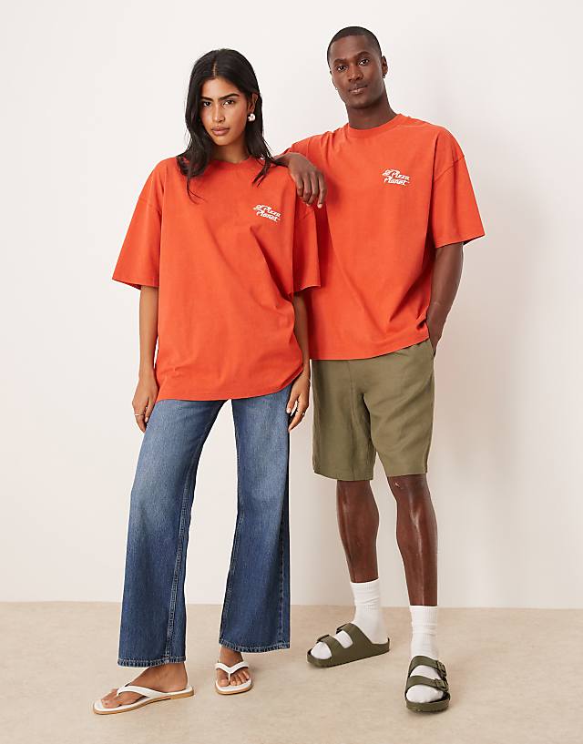 Asos ASOS DESIGN Disney Pixar Unisex Oversized T-shirt With Toy Story Pizza Planet Prints In Washed Red