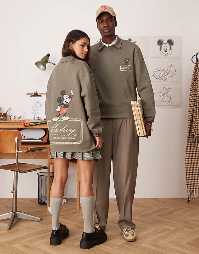 asos ASOS DESIGN Disney unisex oversized polo sweatshirt with Mickey Mouse prints in khaki