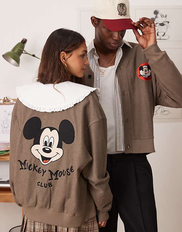 asos ASOS DESIGN Disney unisex oversized reverse loopback jersey cardigan with Mickey Mouse prints in brown