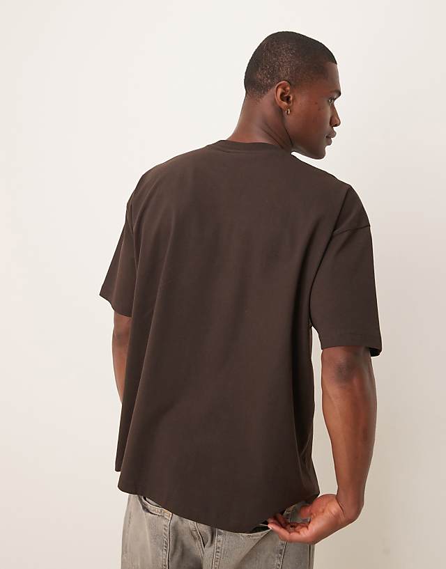 Asos ASOS DESIGN Disney Unisex Oversized T-shirt With Toy Story Woody Print In Brown