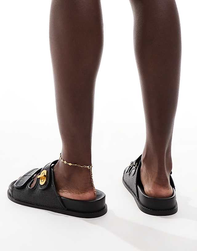 Asos ASOS DESIGN Fawn Footbed Sliders With Twist Lock In Black