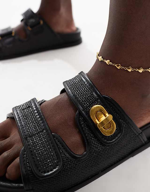 Asos ASOS DESIGN Fawn Footbed Sliders With Twist Lock In Black