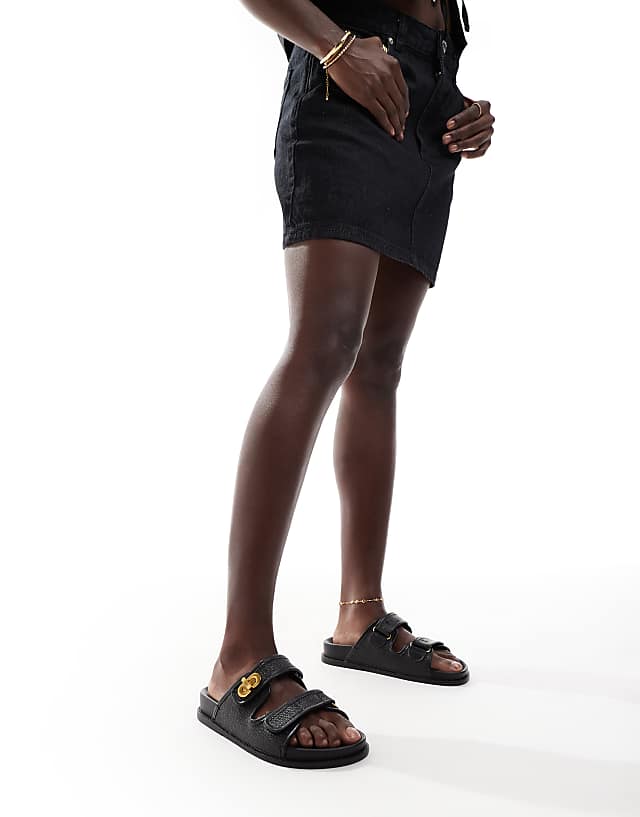 Asos ASOS DESIGN Fawn Footbed Sliders With Twist Lock In Black