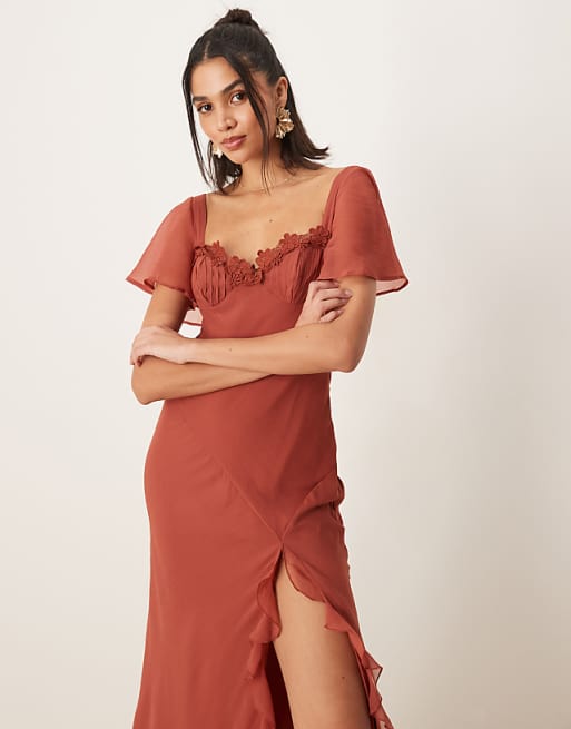 Asos ASOS DESIGN Flutter Sleeve Lace Trim Ruffle Split Midaxi Dress With Open Back In Rust