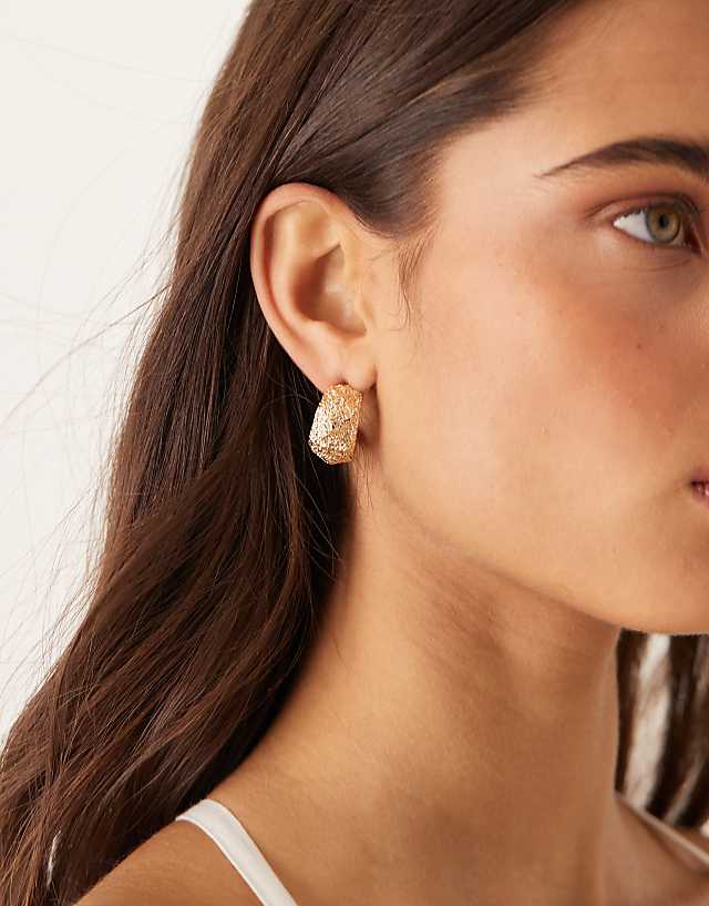 asos ASOS DESIGN half hoop earrings in textured abstract design in gold tone