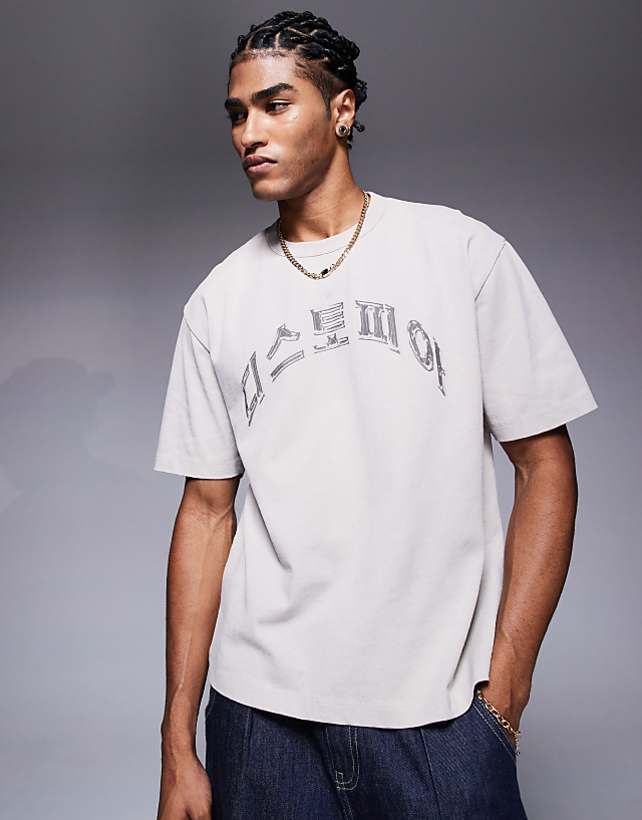 asos ASOS DESIGN heayweight boxy relaxed t-shirt in washed beige with text graphic