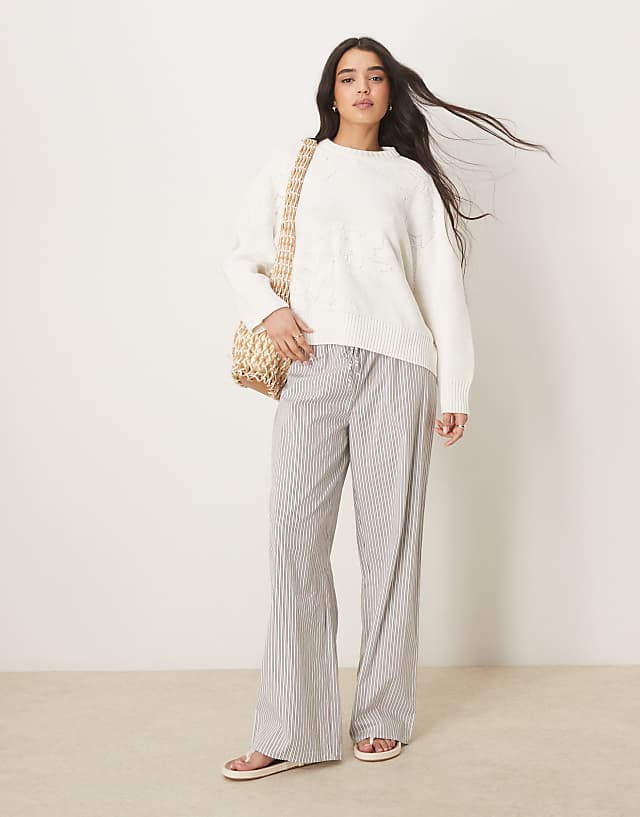 Asos ASOS DESIGN Knitted Crew Neck Jumper With Flower Stitch In Cream