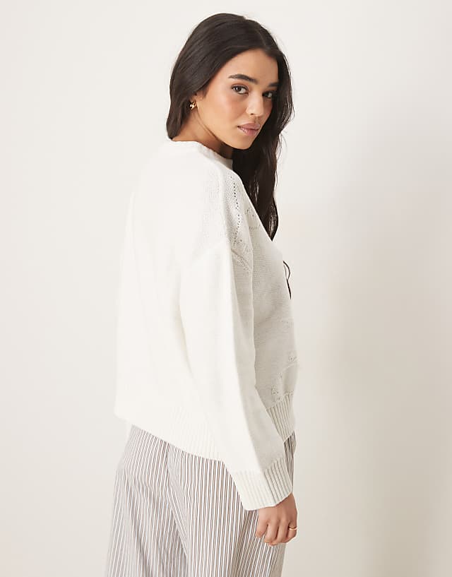 Asos ASOS DESIGN Knitted Crew Neck Jumper With Flower Stitch In Cream