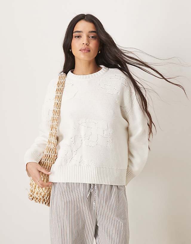 asos ASOS DESIGN knitted crew neck jumper with flower stitch in cream asos ASOS DESIGN knitted crew neck jumper with flower stitch in cream