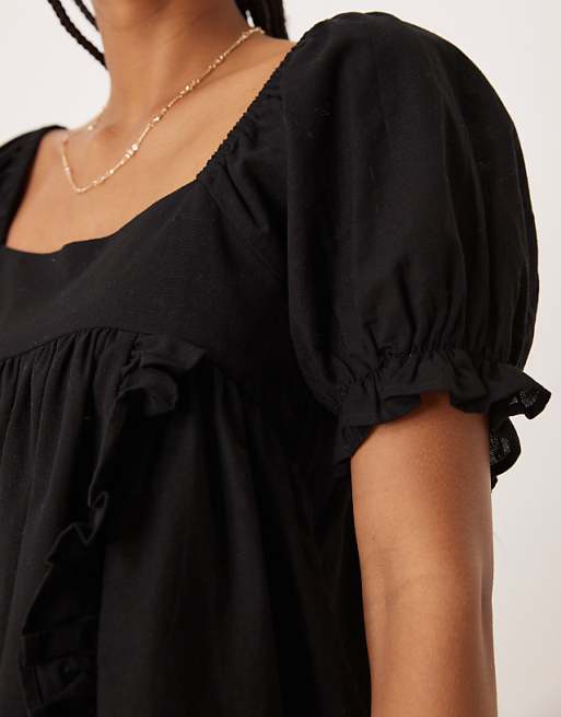 Asos ASOS DESIGN Linen Babydoll Puff Sleeve Playsuit With Bow Back Detail In Black