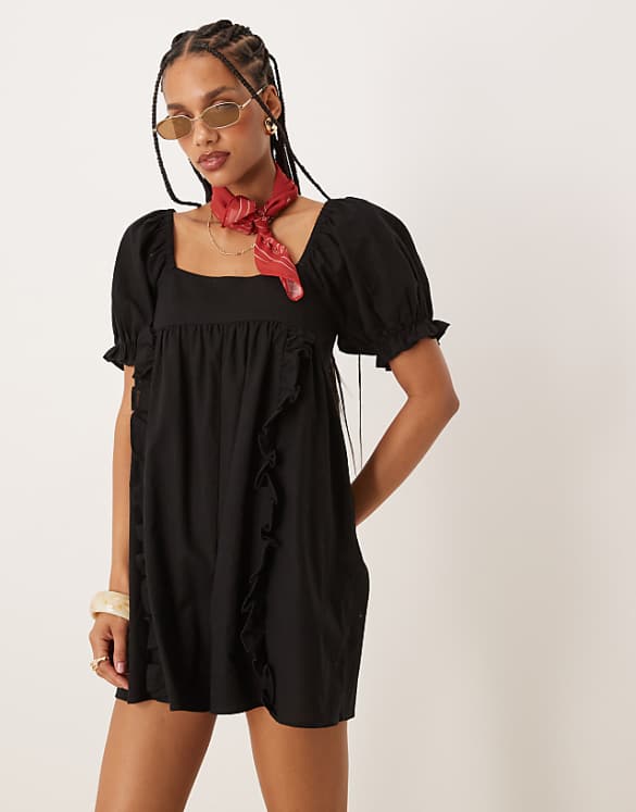 asos ASOS DESIGN linen babydoll puff sleeve playsuit with bow back detail in black