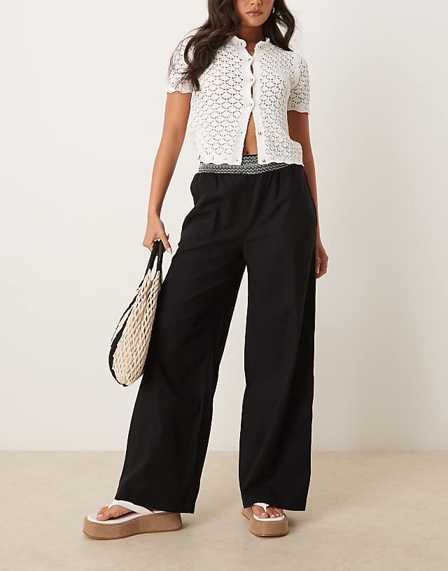 asos ASOS DESIGN linen blend pull on wide leg trousers with shirred waist detail in black with cream