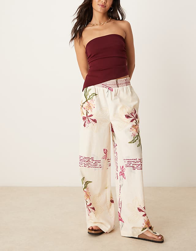 asos ASOS DESIGN linen blend pull on wide leg trousers with shirred waist detail in floral print