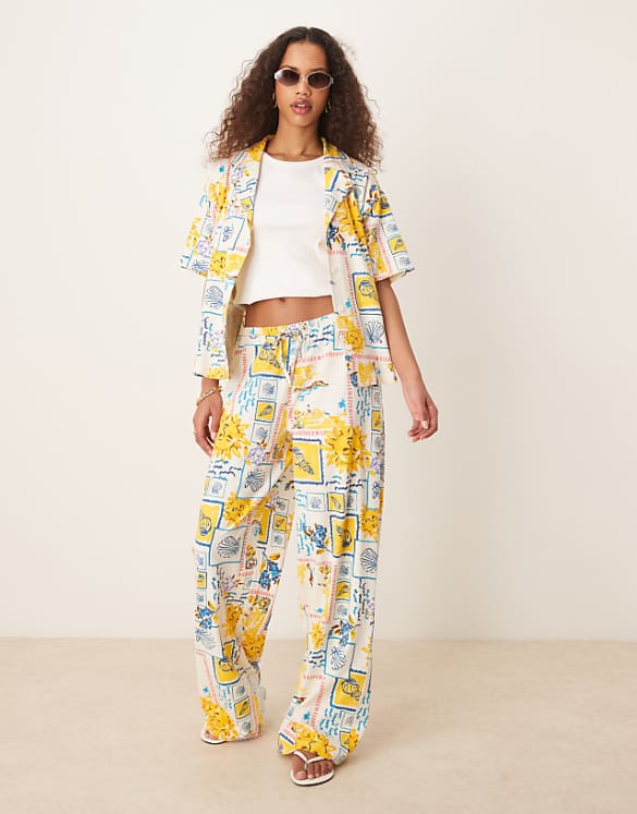 asos ASOS DESIGN linen look shorts trousers and shirt co-ord in postcard print