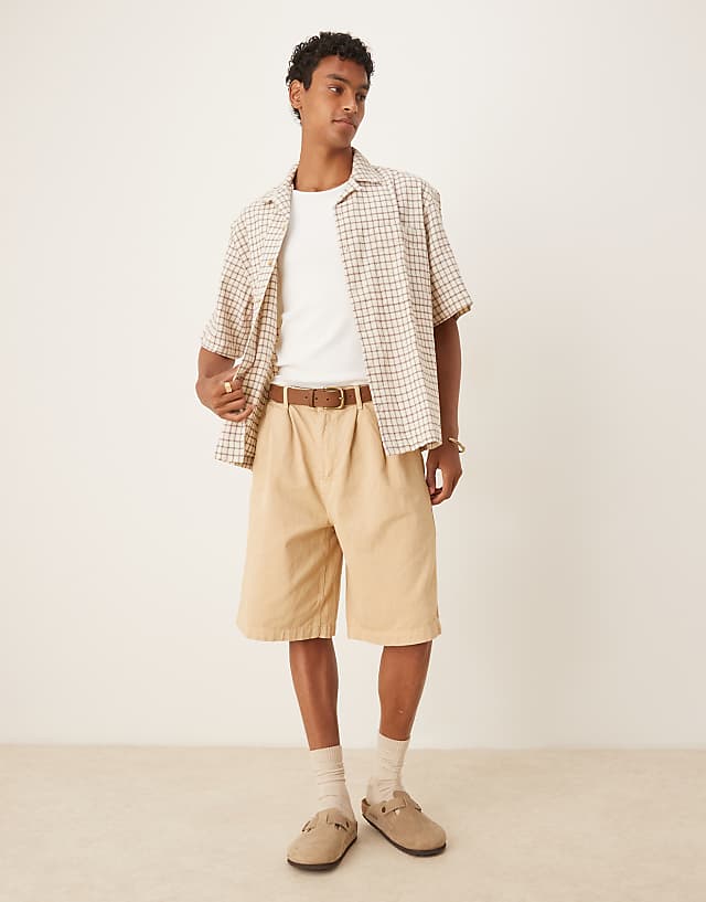 asos ASOS DESIGN long length pleated shorts in beige